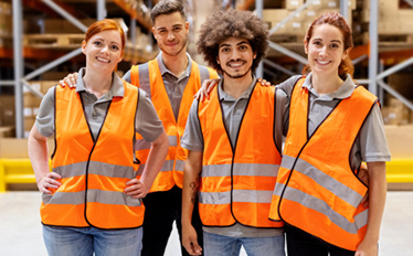 Group of frontline manufacturing workers in warehouse