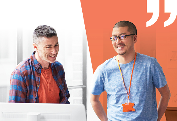 Two coworkers smiling